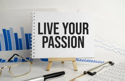 Notebook with Tools and Notes with text LIVE YOUR PASSION Stock Photos