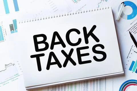 Notebook with Tools and Notes with text BACK TAXES Stock Photos