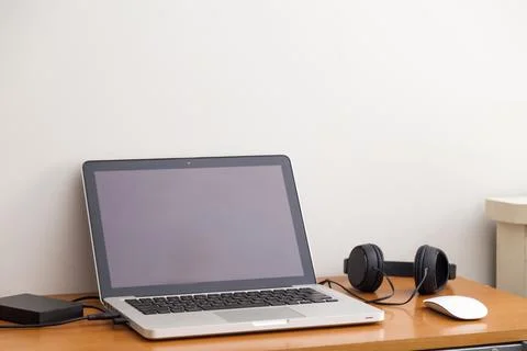 Notebook on top of a home office desk. Copy space. Workspace and technology.  Stock-Fotos