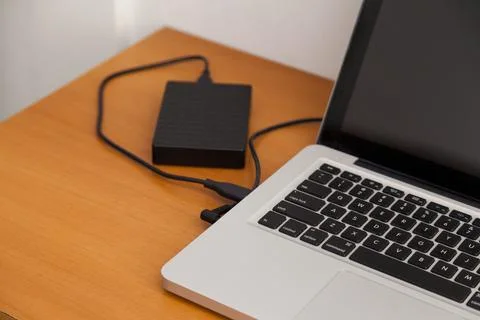 Notebook on top of a home office desk. Copy space. Workspace and technology.  Stock Photos