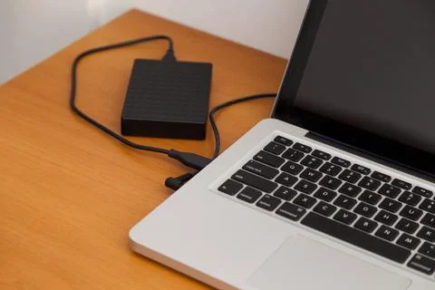 Notebook on top of a home office desk. Copy space. Workspace and technology.  Stock Photos