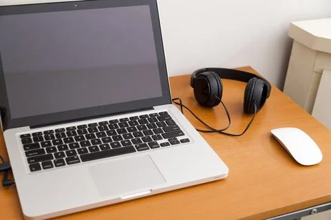 Notebook on top of a home office desk. Copy space. Workspace and technology.  Stock Photos