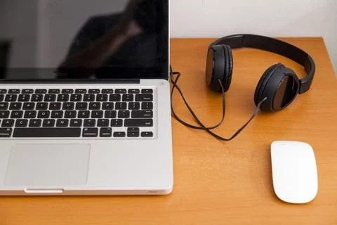 Notebook on top of a home office desk. Copy space. Workspace and technology.  Stock Photos