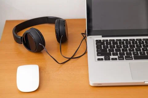 Notebook on top of a home office desk. Copy space. Workspace and technology.  Stock Photos