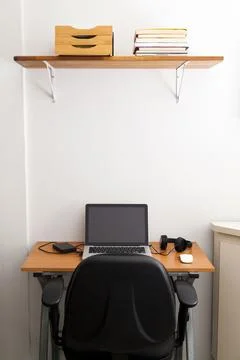 Notebook on top of a home office desk. Copy space. Workspace and technology.  Stock Photos