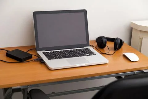 Notebook on top of a home office desk. Copy space. Workspace and technology.  Stock Photos