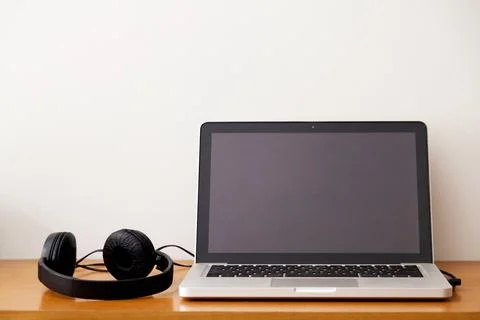 Notebook on top of a home office desk. Copy space. Workspace and technology.  Stock Photos