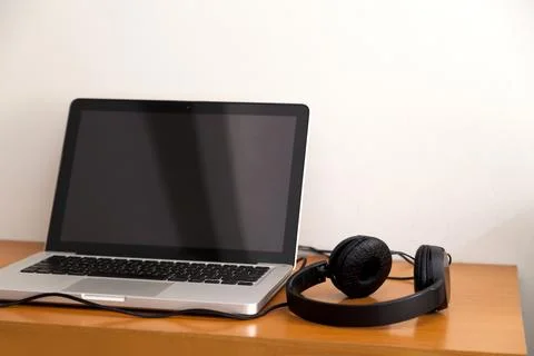 Notebook on top of a home office desk. Copy space. Workspace and technology.  Stock Photos