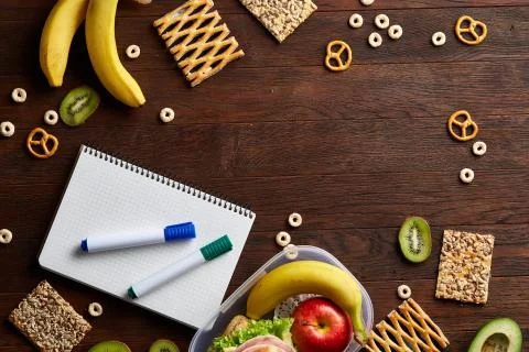A notebook, two markers and assortment of cookies on a white background, copy Stock Photos