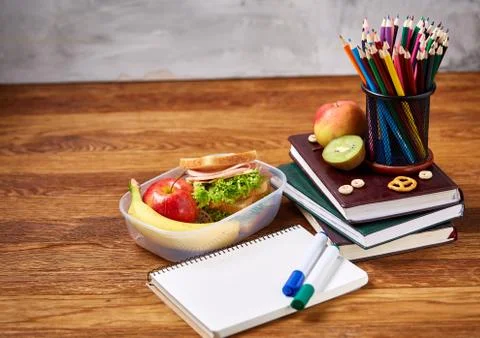 A notebook, two markers and assortment of cookies on a wooden table, copy space Stock Photos