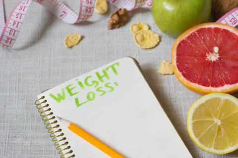 Notebook for weight loss plan or menu Stockfoto's