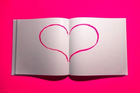 Notebook with white blank pages for notes on pink background. Stock Photos