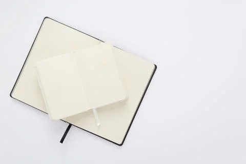 Notebook at white paper background Stock Photos