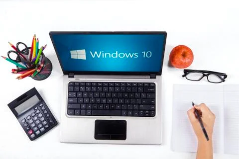 Notebook with windows 10 and student hand 스톡 사진
