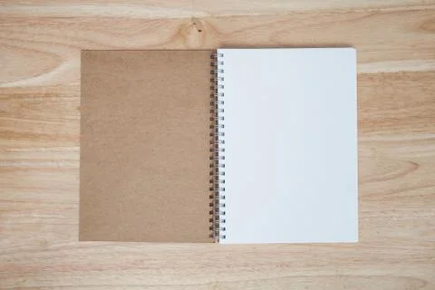 Notebook on wood table Foto stock