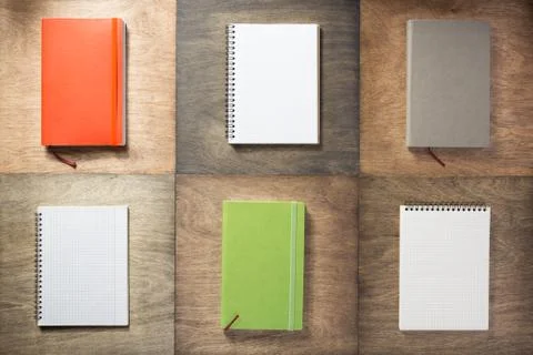 Notebook at wooden background Stock Photos