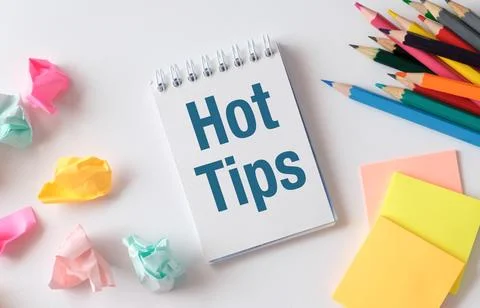 A notebook with the word Hot Tips written on it Stock Photos