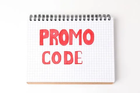 Notebook with words Promo Code on white background, top view Foto stock