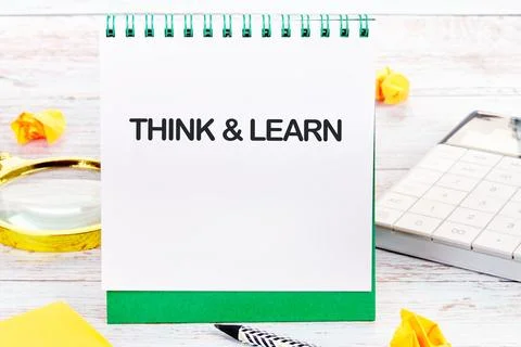 Notebook with the words THINK and LEARN encourages dedication to learning abo Stock Photos
