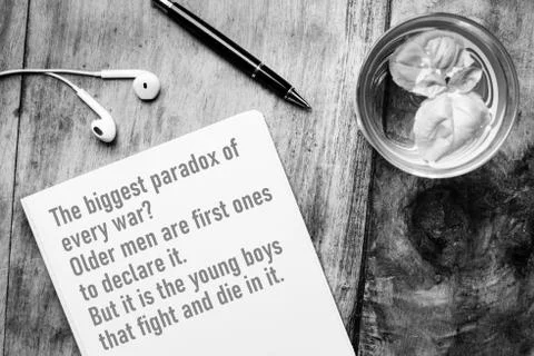 Notebook with words of wisdom about war - The biggest paradox of every war? O Stock Photos