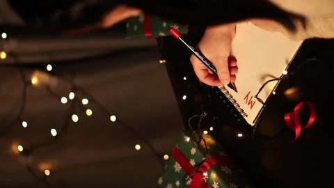 Notebook with written plans for new year 2025 in Christmas decoration Stock Footage 292116258