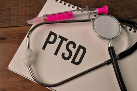 Notebook written with PTSD stands for Post Traumatic Stress Disorder 스톡 사진