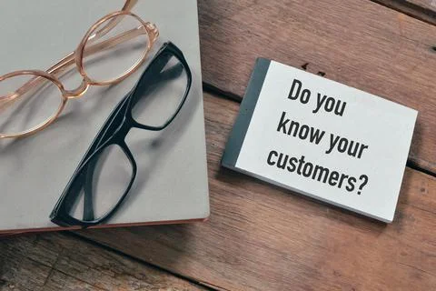 Notebook written with question DO YOU KNOW YOUR CUSTOMER? Stock Photos