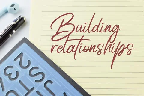 Notebook written with text BUILDING RELATIONSHIPS Stock Photos