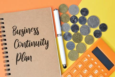 Notebook written with text BUSINESS CONTINUITY PLAN. Stock Photos