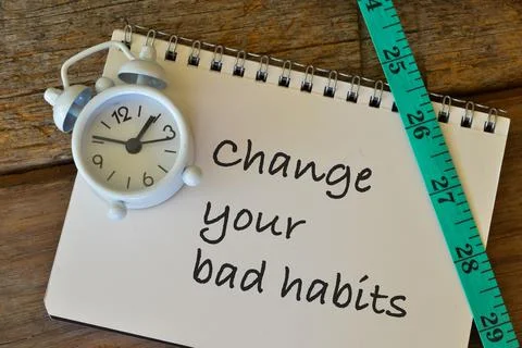Notebook written with text CHANGE YOUR BAD HABITS. Stock Photos