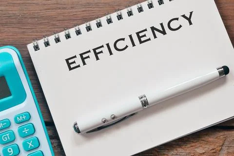 Notebook written with text EFFICIENCY. Selective focus. Stock Photos