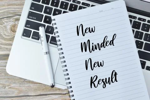 Notebook written with text NEW MINDED NEW RESULTS Stock Photos