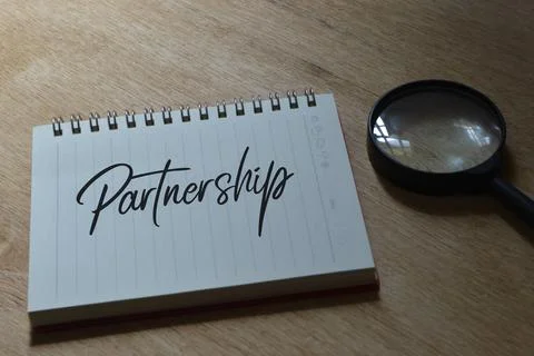 Notebook written with text PARTNERSHIP. Selective focus. Stock Photos