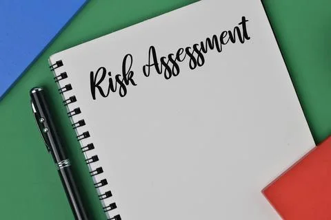 Notebook written with text RISK ASSESSMENT. Business concept. Stock Photos