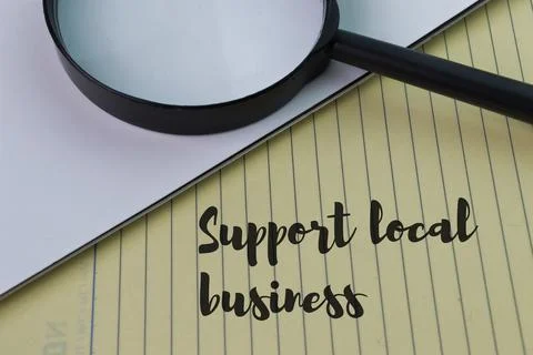 Notebook written with text SUPPORT LOCAL BUSINESS. Stock Photos