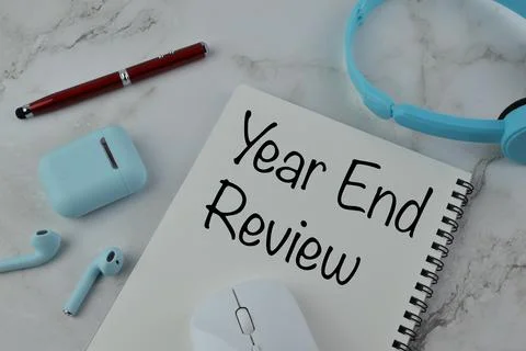 Notebook written with text YEAR END REVIEW Stock Photos