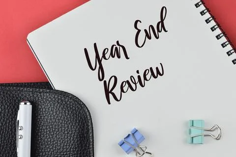 Notebook written with text YEAR END REVIEW. Stock Photos