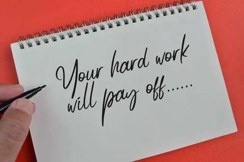 Notebook written with text YOUR HARD WORK WILL PAY OFF Stock Photos