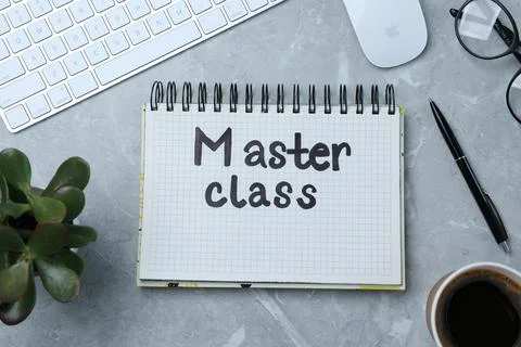 Notebook with written words Master Class, computer keyboard and mouse on grey 스톡 사진