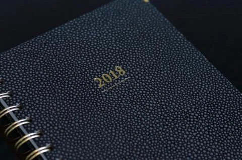 Notebook with the year 2018 in focus  Stock Photos