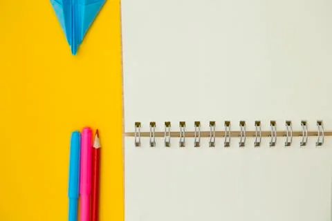 A notebook on a yellow background Stock Photos