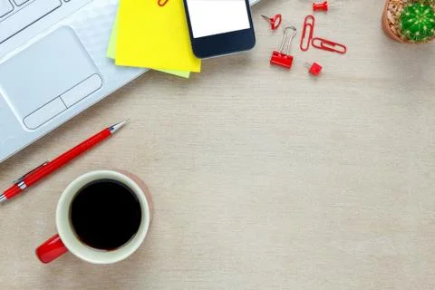Notebook,pencil,black coffee,cactus,note paper,smartphone,Laptop on office desk Stock Photos