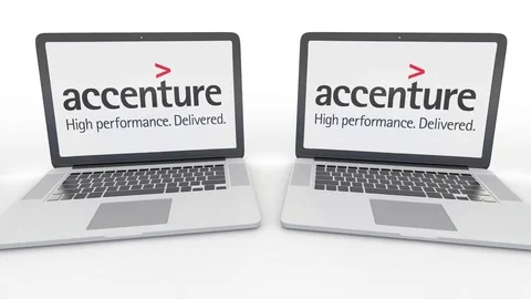 Notebooks with Accenture logo on the screen. Computer technology conceptual Stock Footage