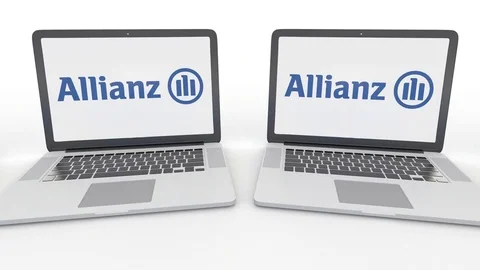 Notebooks with Allianz logo on the screen. Computer technology conceptual Stock Footage