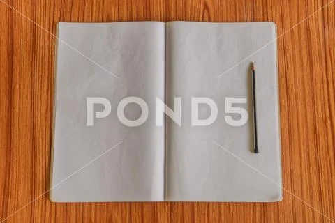 Notebooks and pencil isolated on wooden table hardwood floor. Ready to write Stock Photos