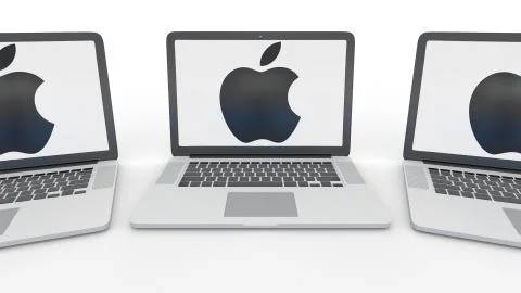 Notebooks with Apple Inc. logo on the screen. Modern office building entrance Stock Illustration
