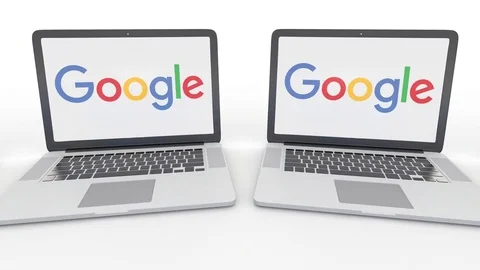 Notebooks with Google logo on the screen. Computer technology conceptual Stock Footage