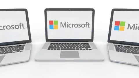 Notebooks with Microsoft logo on the screen. Computer technology conceptual Illustrazione stock