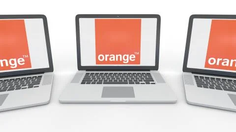 Notebooks with Orange S.A. logo on the screen. Computer technology conceptual Stock Illustration