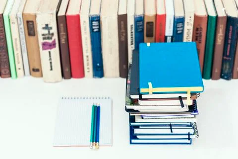 Notebooks piles, stack of books education back to school background, textbook Stock Photos